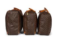 A Group of Three Louis Vuitton Soft-Sided Suitcases, 20th Century