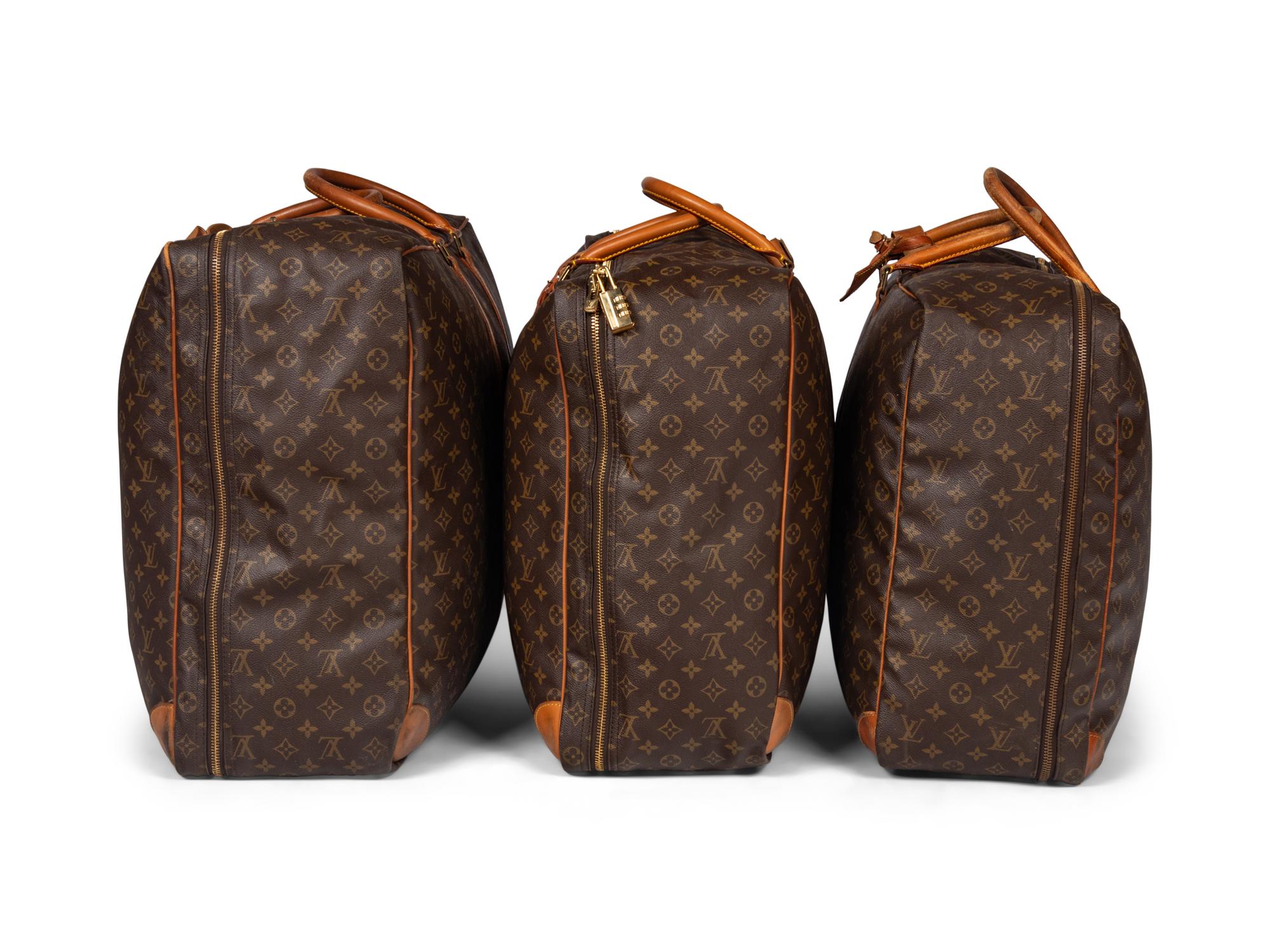 A Group of Three Louis Vuitton Soft-Sided Suitcases, 20th Century