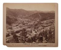 [WESTERN AMERICANA]. A group of photographs, many taken in the Western United States, highlighted by 2 photographs of Deadwood, South Dakota, taken by H.R. LOCKE.