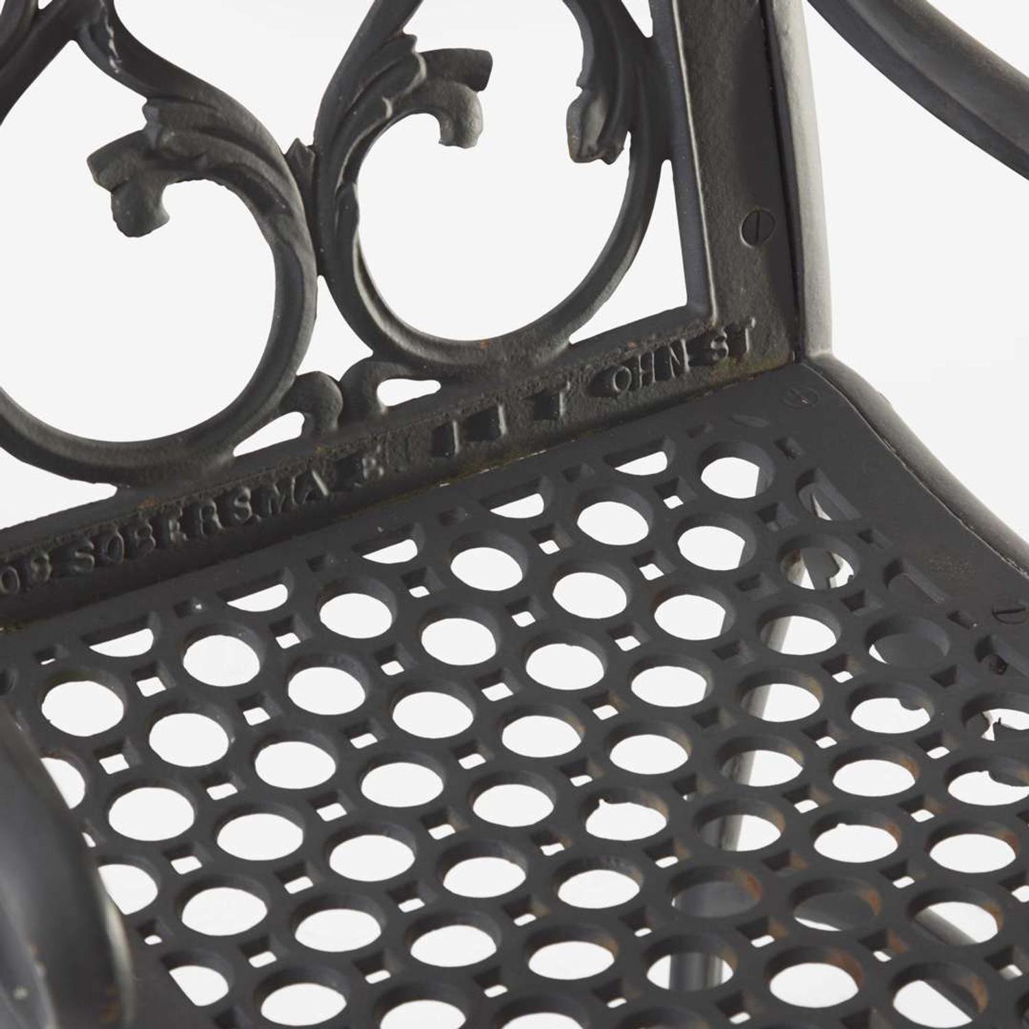 A pair of black-painted cast iron garden armchairs and bench Jacob Sobers, Philadelphia, PA, and John Mclean, New York, NY, late 19th century