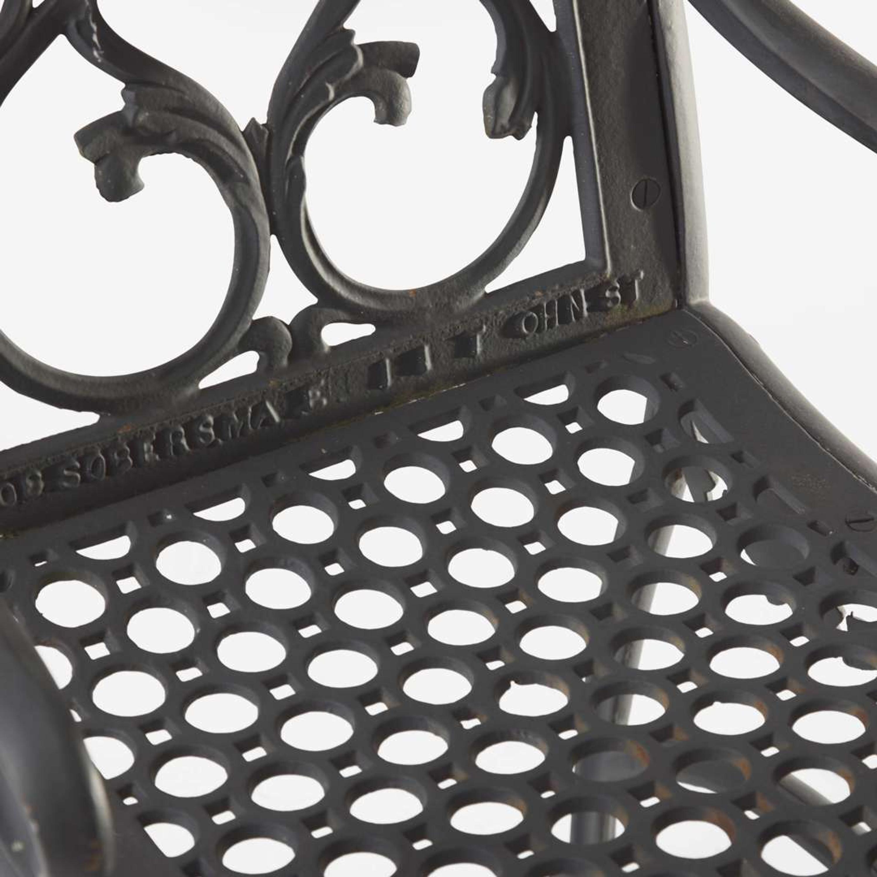 A pair of black-painted cast iron garden armchairs and bench Jacob Sobers, Philadelphia, PA, and John Mclean, New York, NY, late 19th century