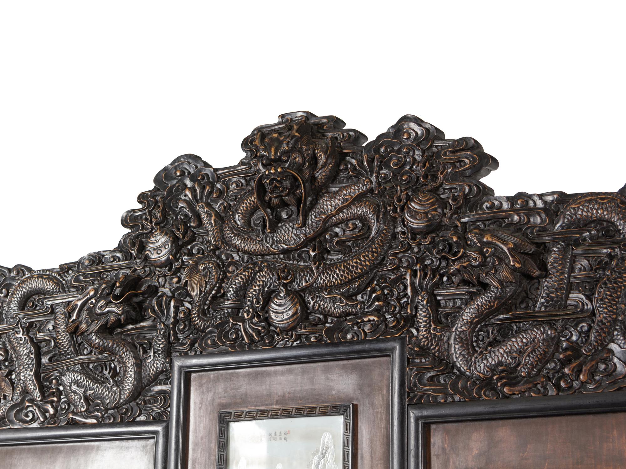 A Large Chinese Porcelain Inset Hardwood Screen