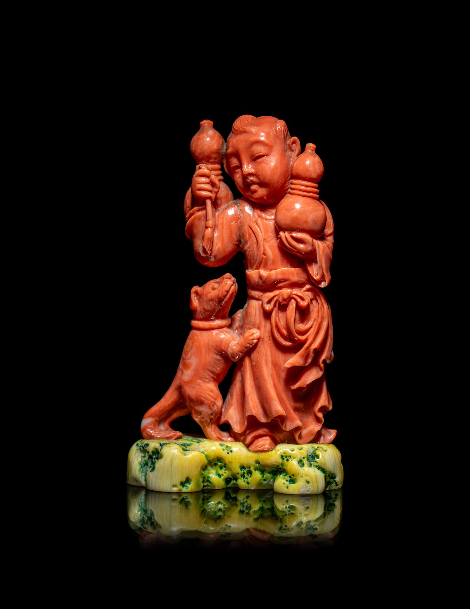A Chinese Coral Figural Group of a Boy and a Dog
