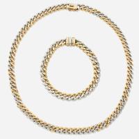 A bicolor gold necklace and matching bracelet Italy