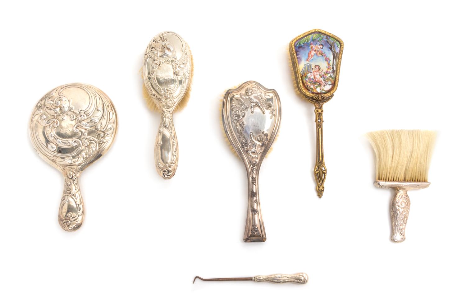 An American Silver Dressing Set, Gorham Mfg. Co., Providence, RI, comprising a brush, a hand mirror, a powder brush and a button hook,