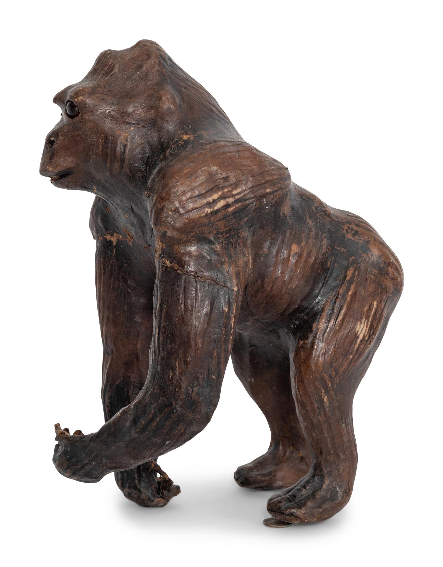 Two Leather Clad Animal Figures