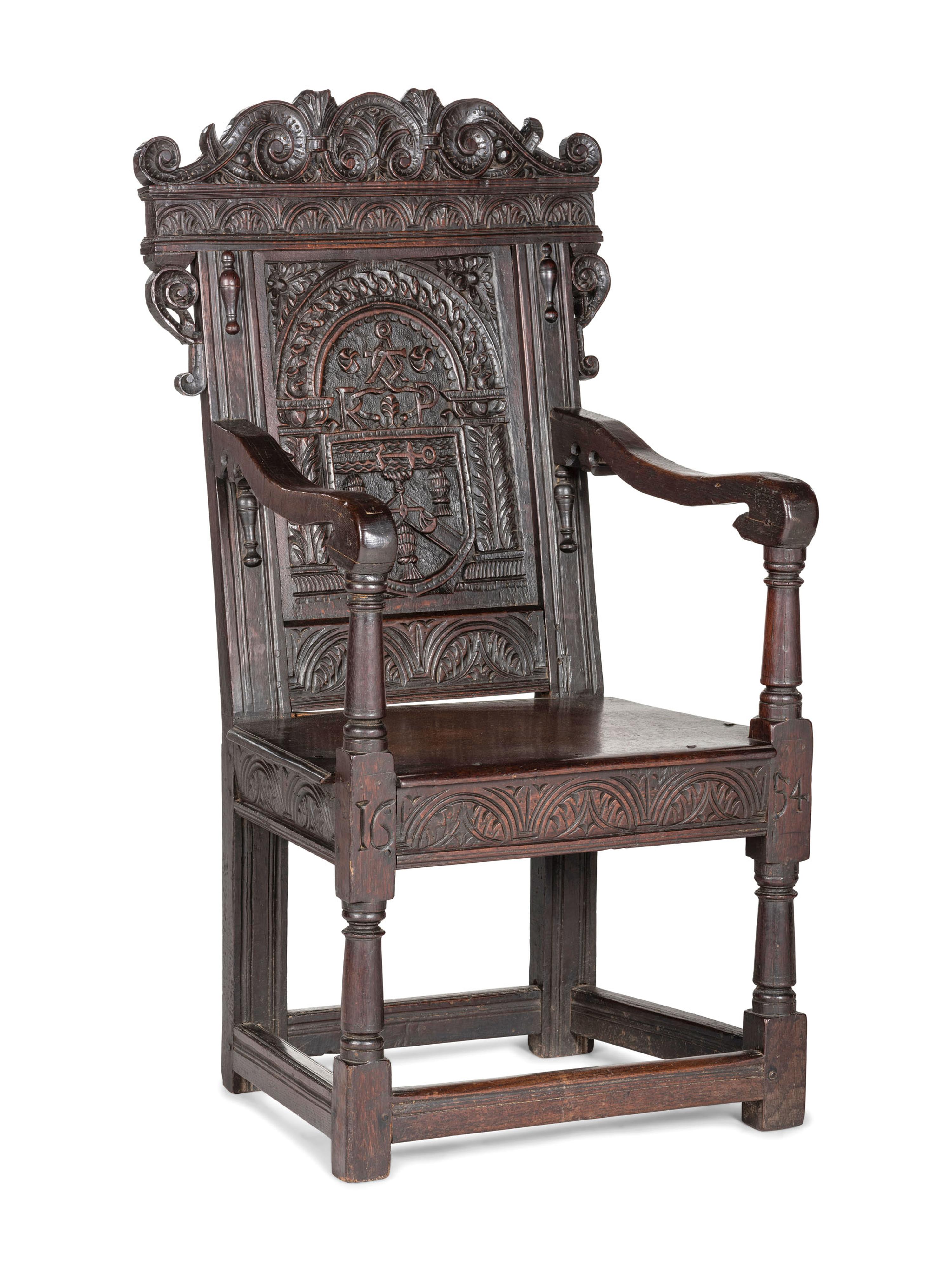 An English Carved Oak and Elm Panel-Back Armchair