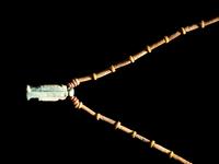 An Egyptian Bead and Faience Necklace with Khnum