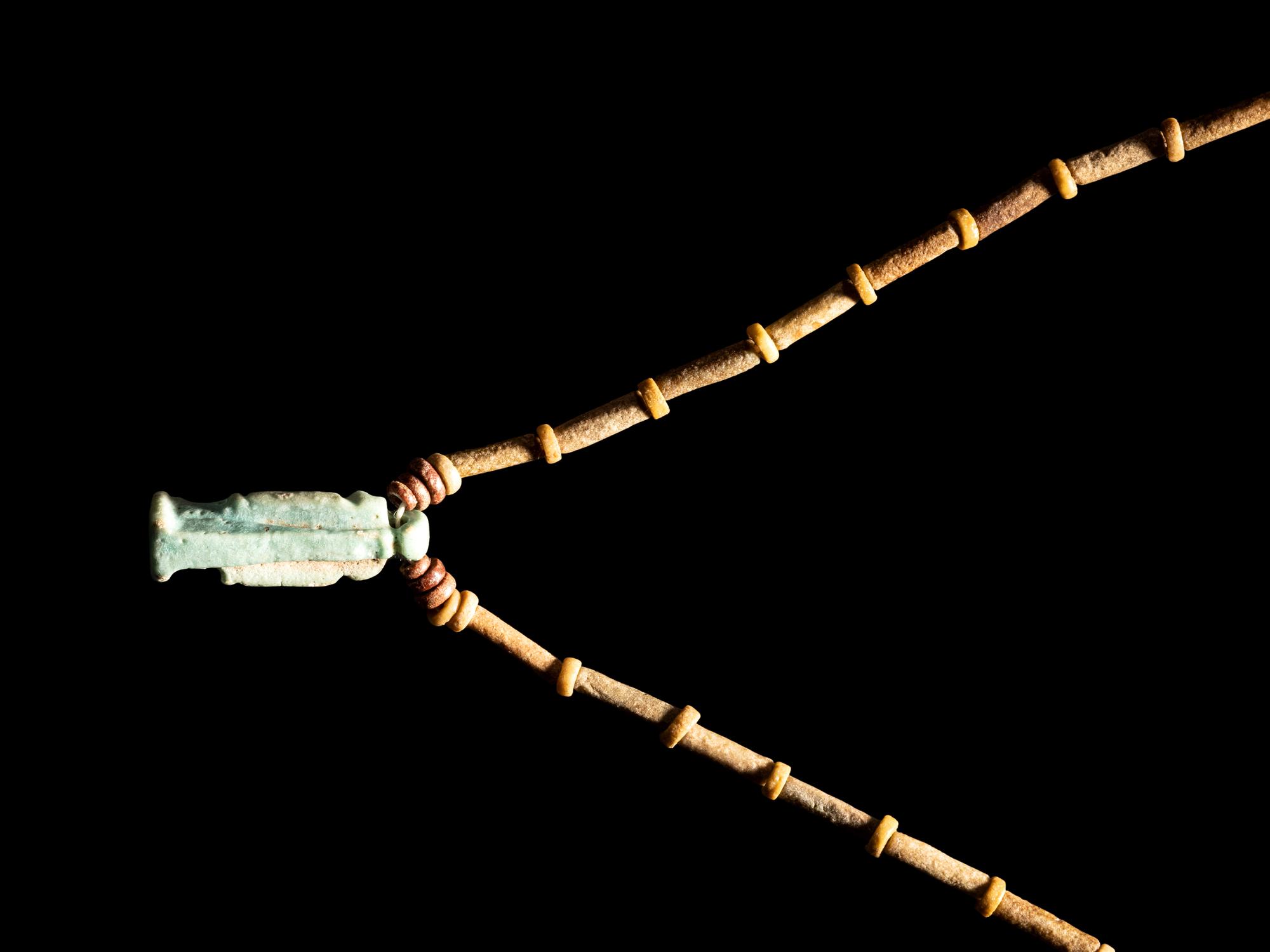 An Egyptian Bead and Faience Necklace with Khnum