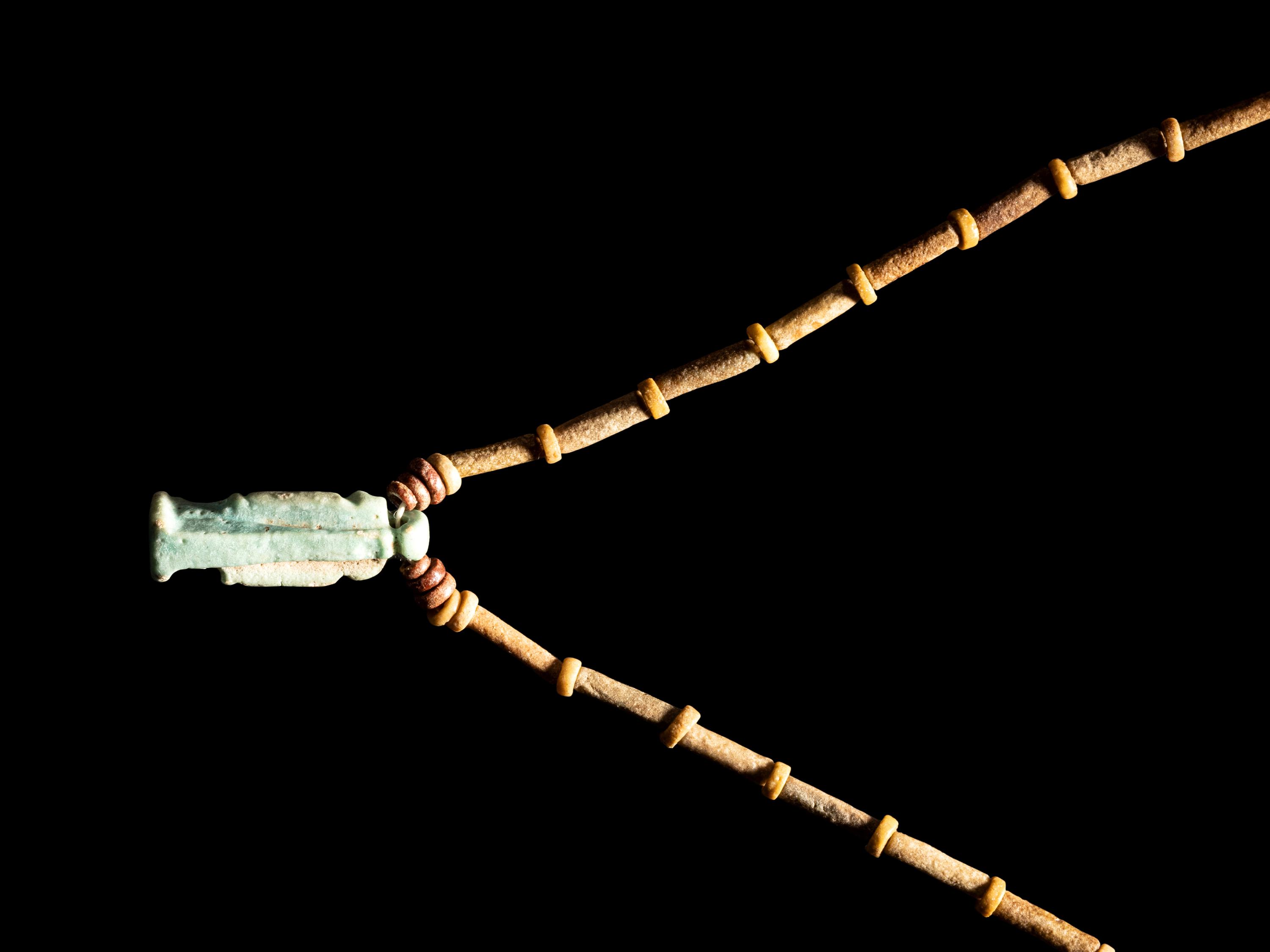 An Egyptian Bead and Faience Necklace with Khnum