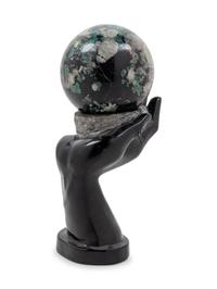 A Carved Hardstone Ornament Depicting a Globe in the Palm of a Hand