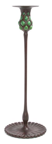 An American Bronze Blown-Out Candlestick Height 17 3/4 inches. — Tiffany Studios, New York