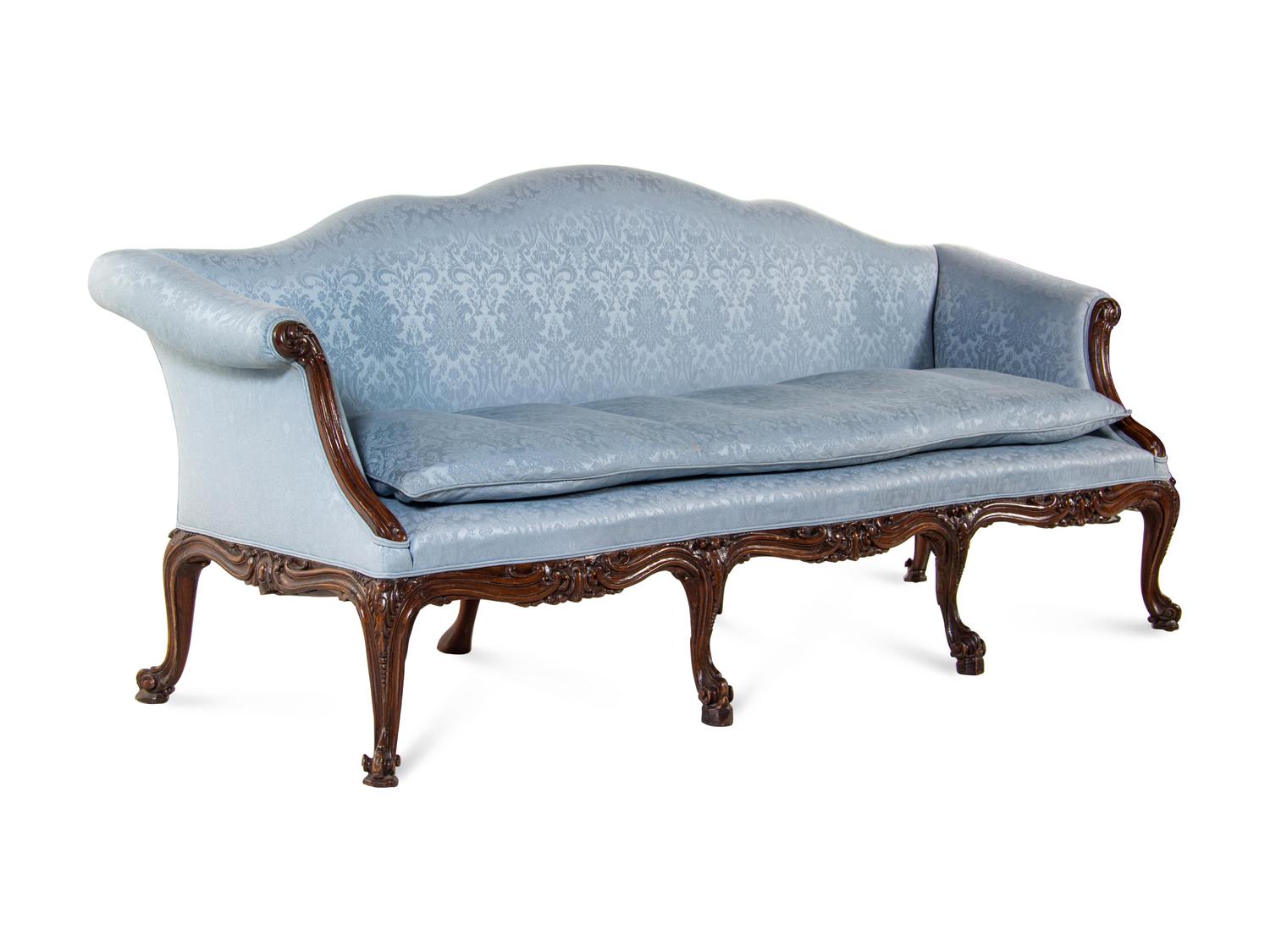 A Pair of George III Carved Oak Sofas
