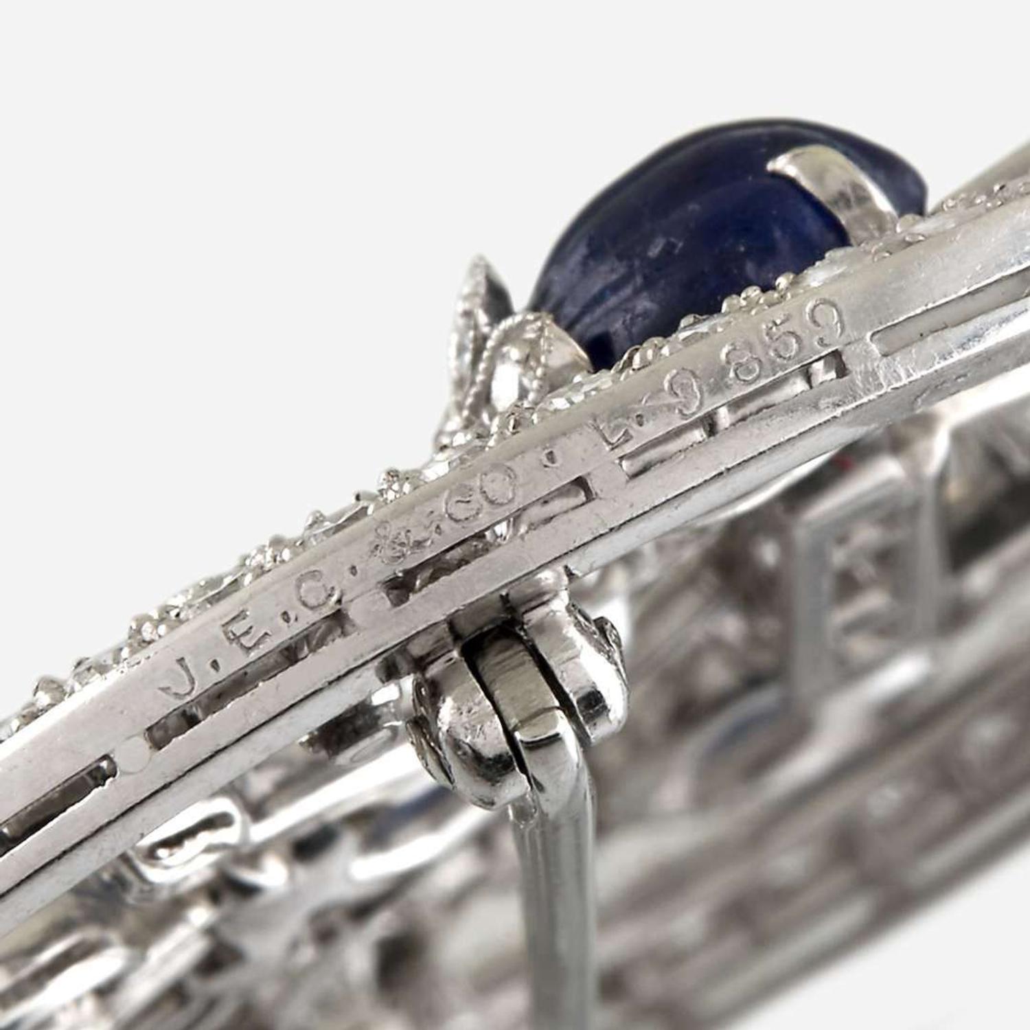 A diamond, carved sapphire, and platinum brooch, J. E. Caldwell & Co.