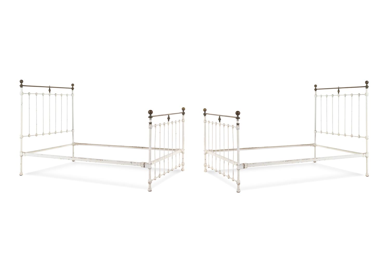 A Pair of Painted Iron Beds
