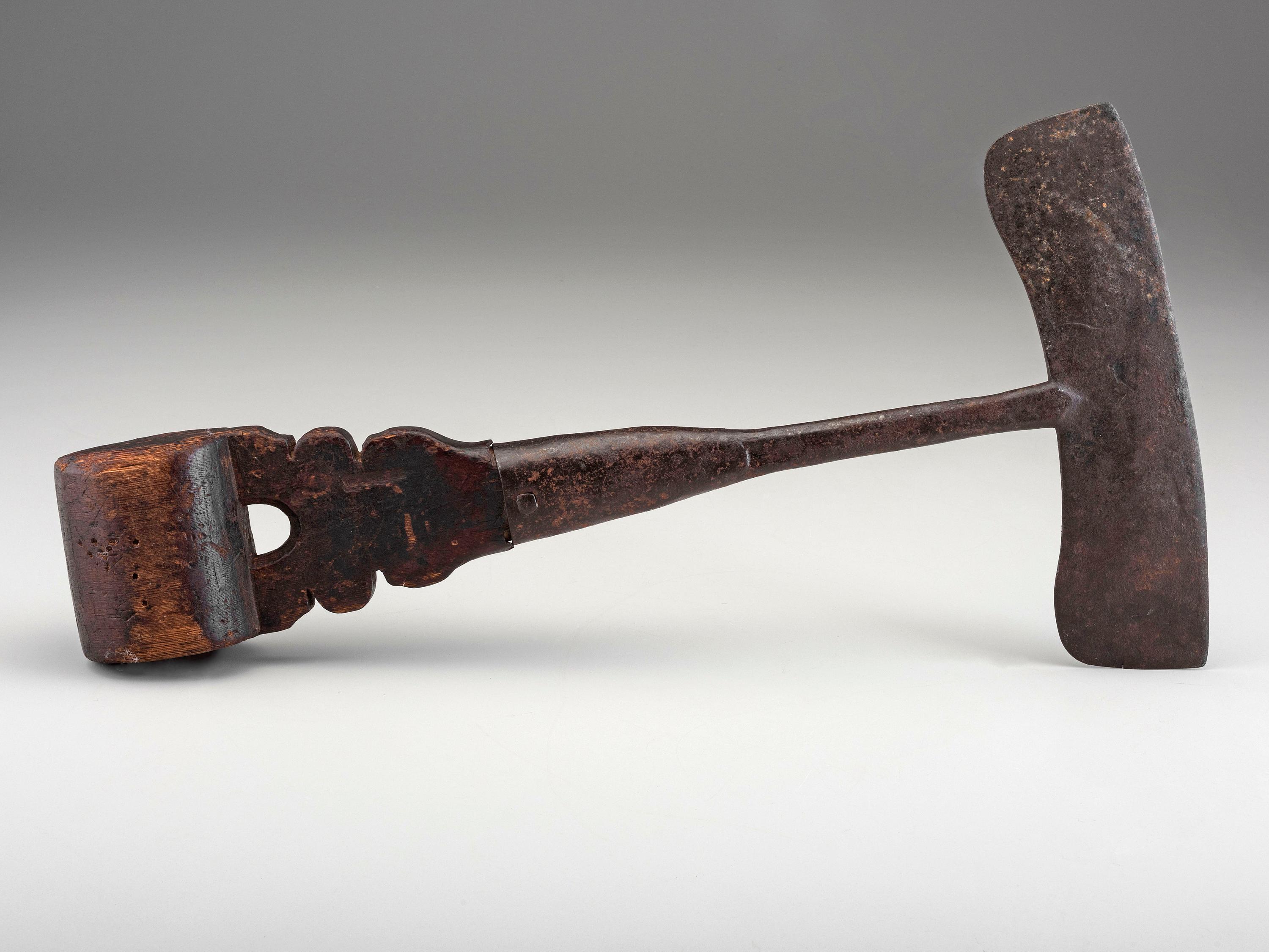 A Carved Wood and Iron Whaling Tool