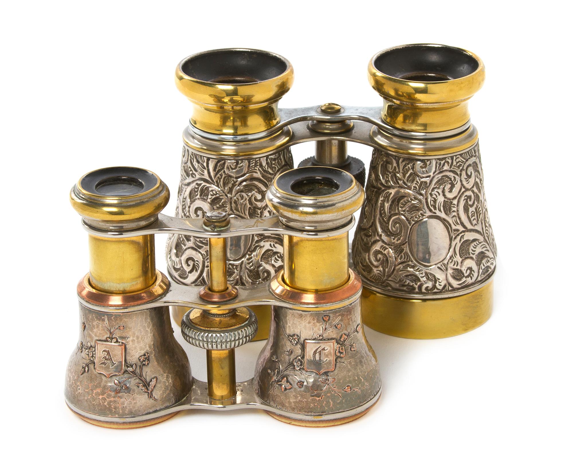 Two Pairs of Continental Silver or Silvered Metal Cased Opera Glasses, Width of first 4 1/2 inches.