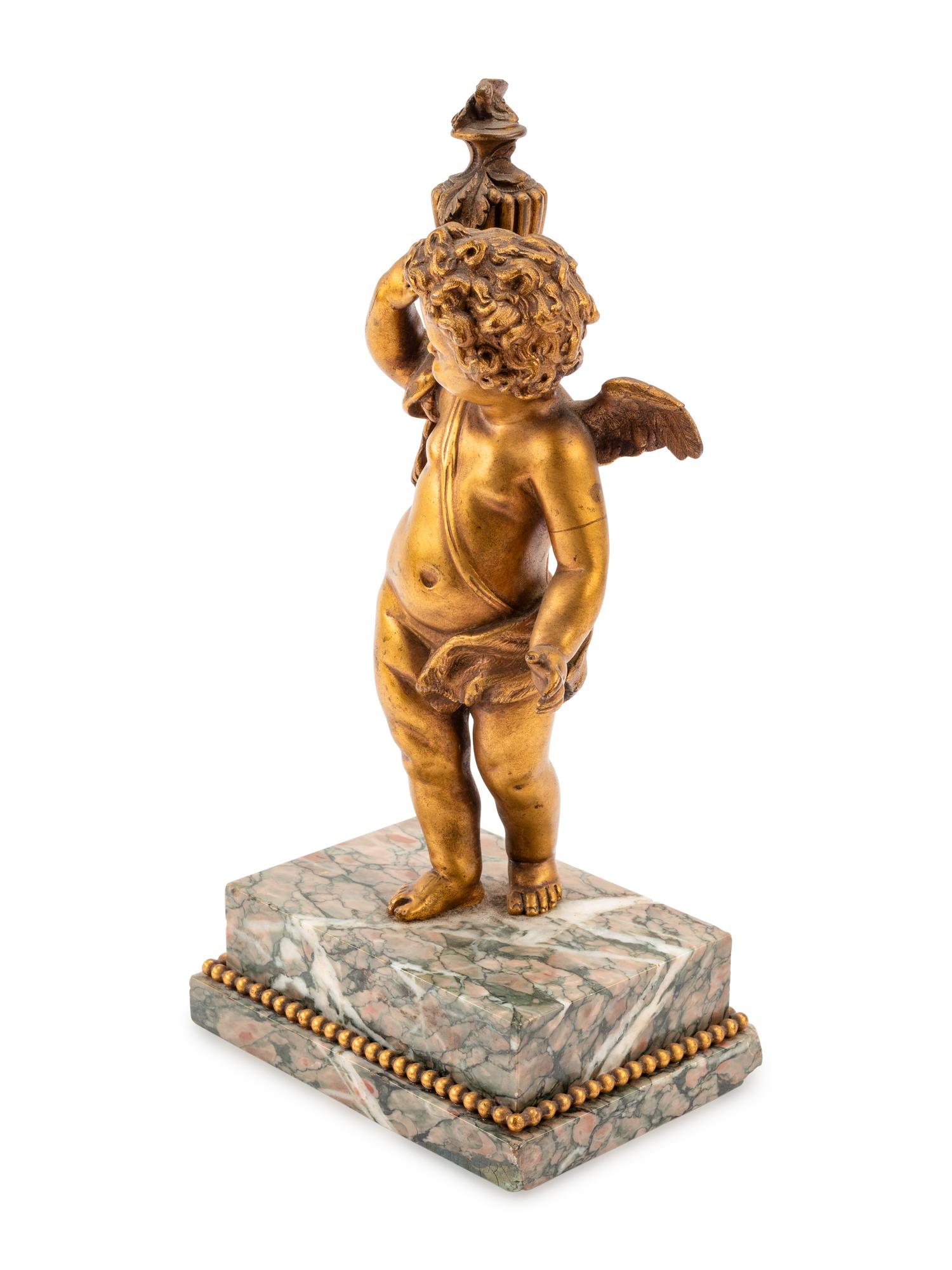 A French Gilt Bronze Figure of a Cherub on a Marble Base