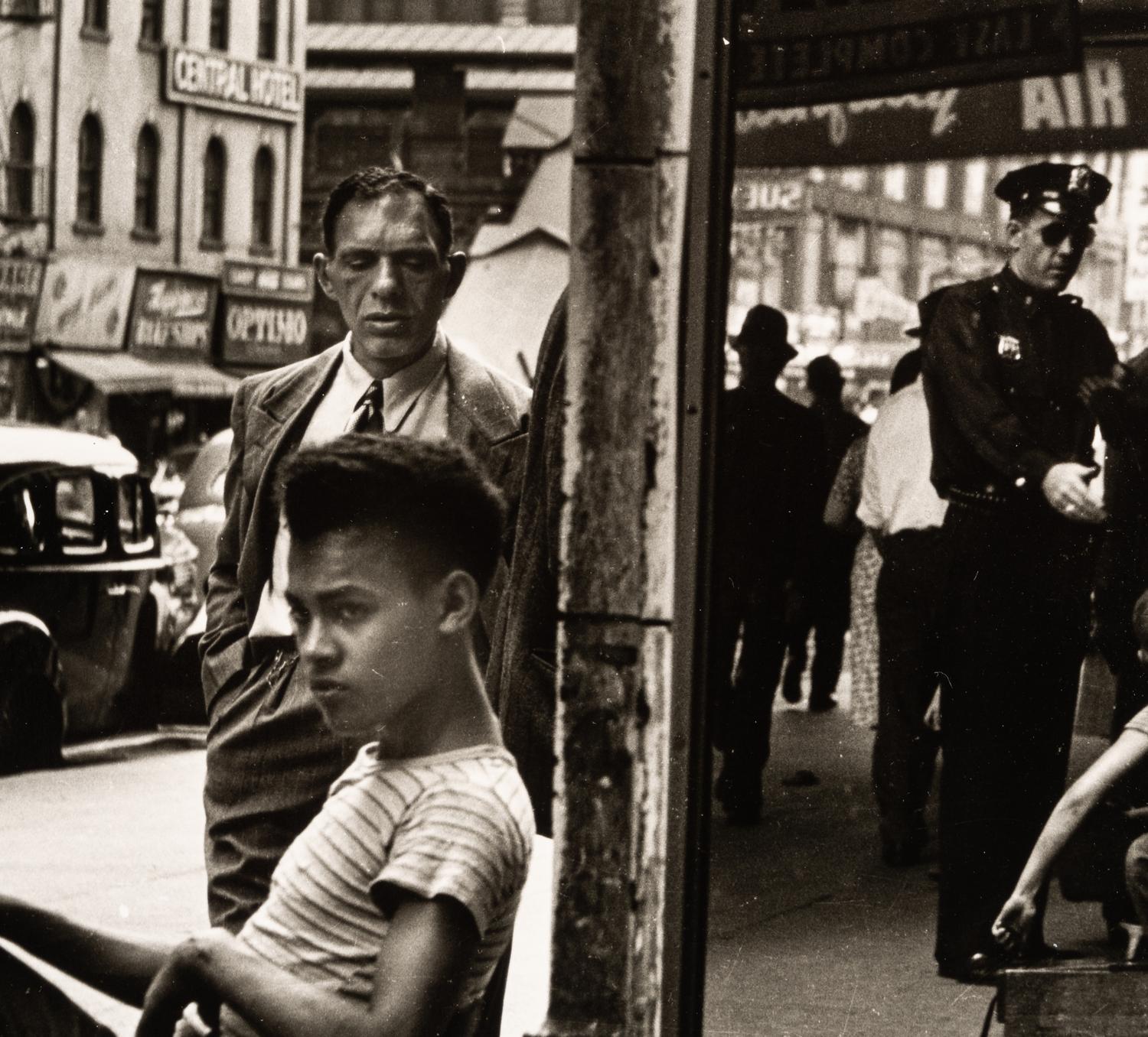 Morris Engel (1918-2005) Shoeshine Boy with Cop, 14th Street, New York City, 1947