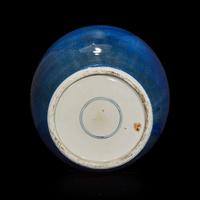 A Chinese powder-blue glazed teapot and cover and an ovoid jar 18th/19th century