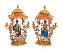 A Pair of French Gilt Bronze and Porcelain Figural Four-Light Candelabra