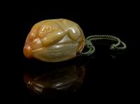 A Carved Jade Toggle Length 2 inches.