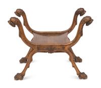 A Renaissance Revival Carved Walnut Curule Bench