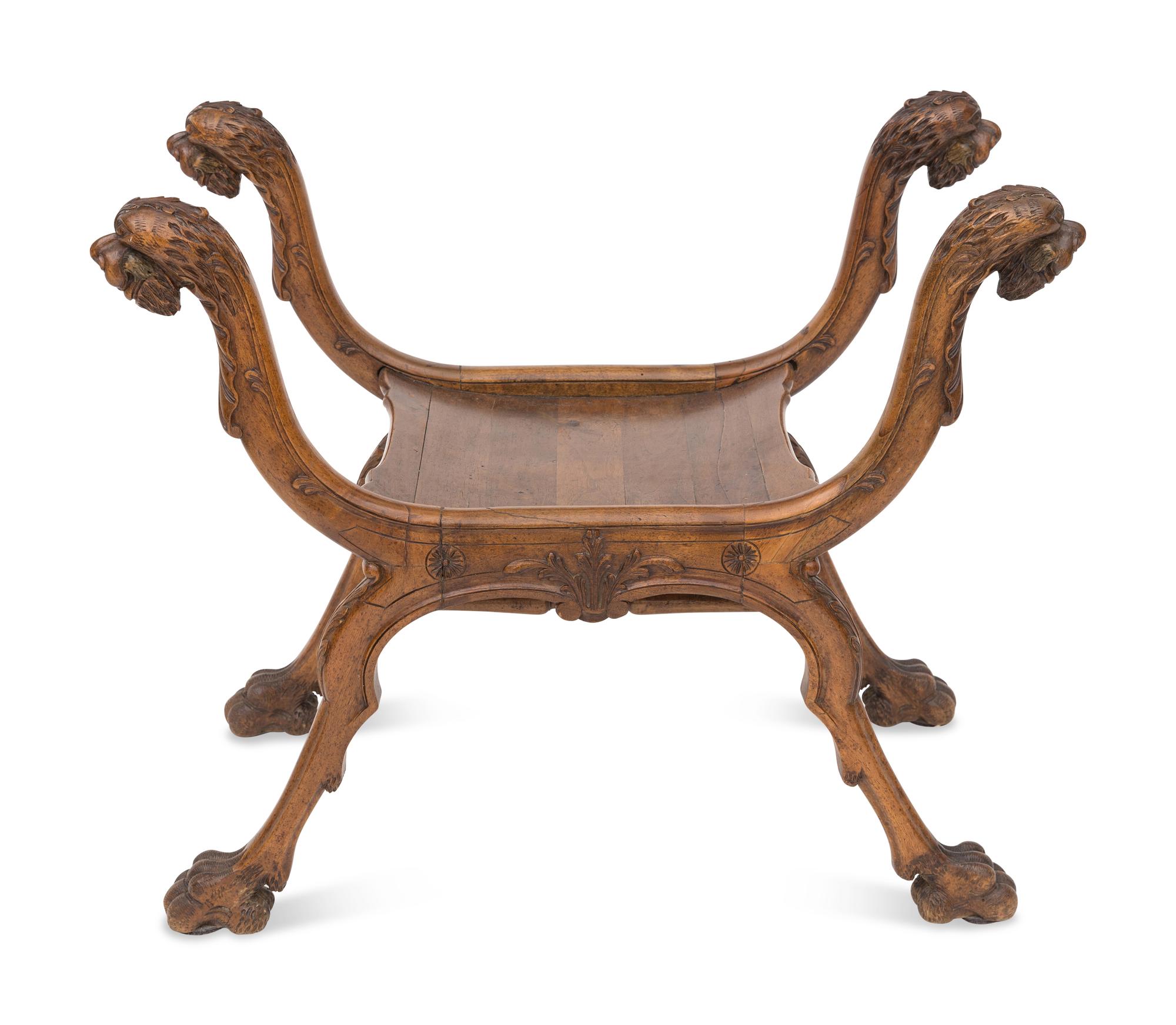 A Renaissance Revival Carved Walnut Curule Bench