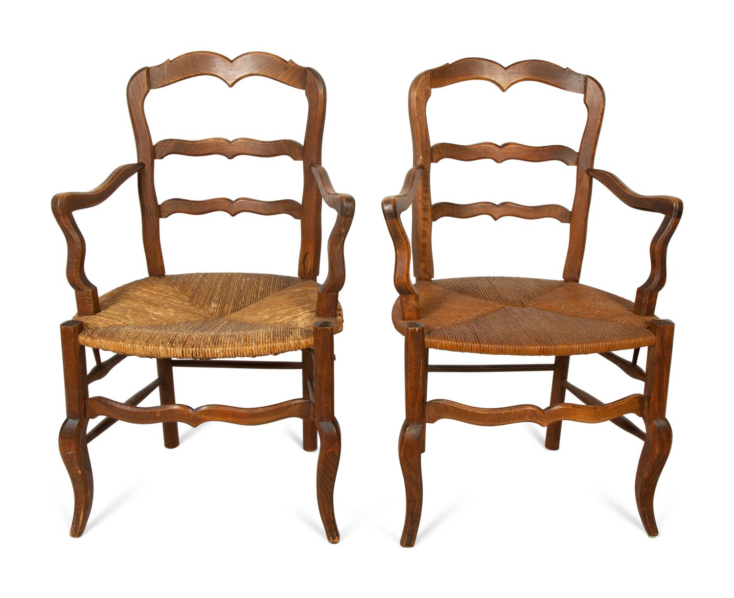 A Set of Four French Provincial Style Walnut Dining Chairs