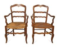 A Set of Four French Provincial Style Walnut Dining Chairs