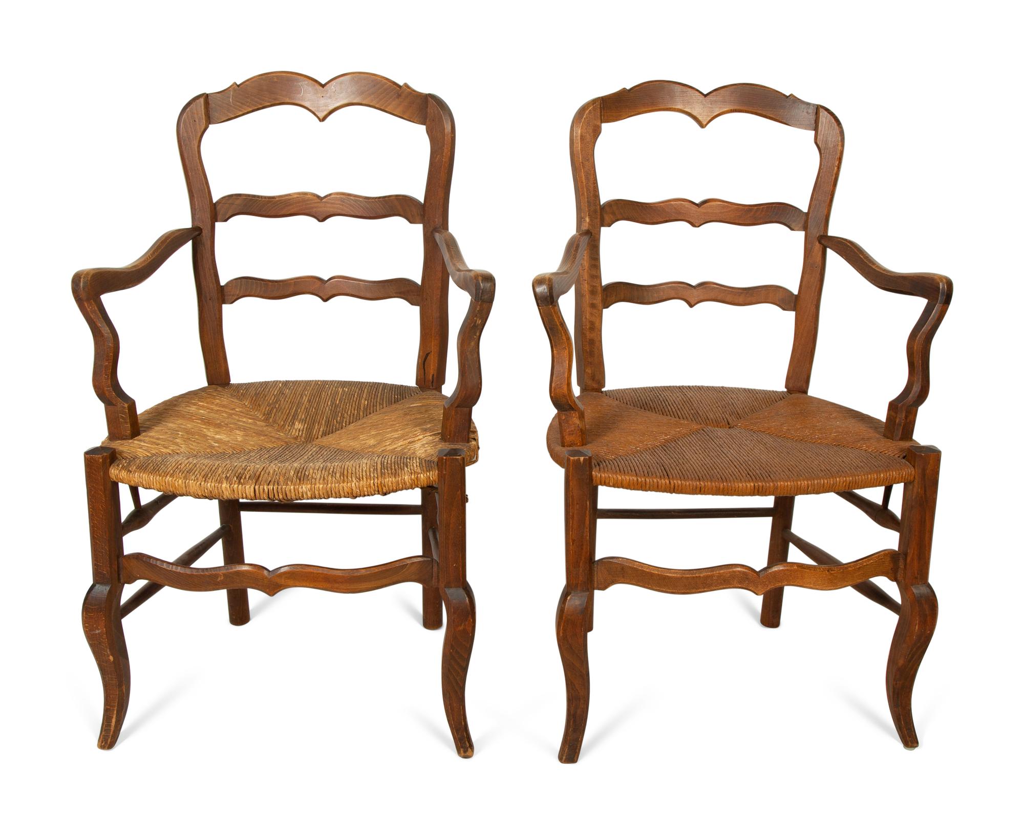 A Set of Four French Provincial Style Walnut Dining Chairs