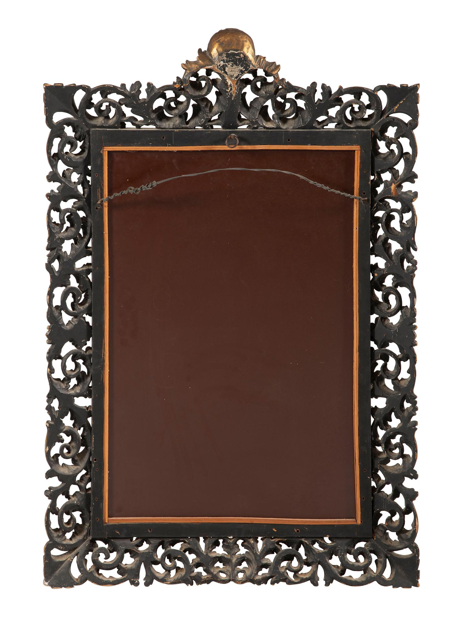 An Italian Baroque Style Giltwood Mirror