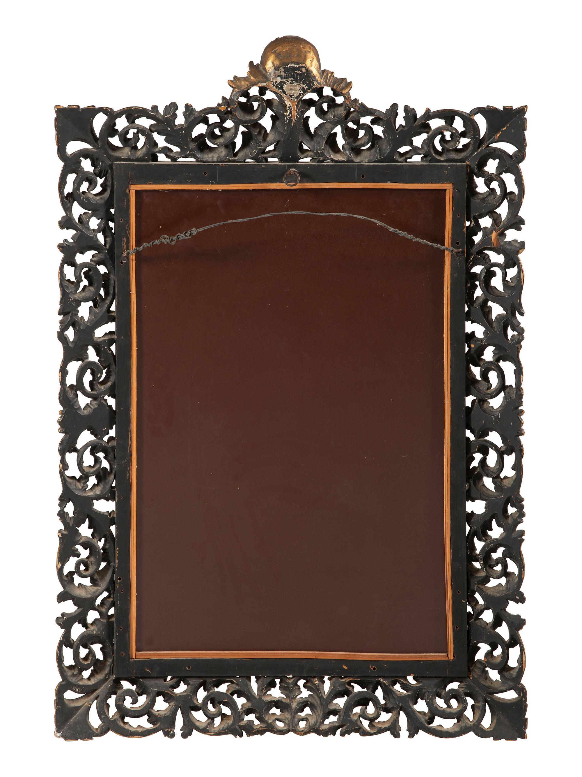 An Italian Baroque Style Giltwood Mirror