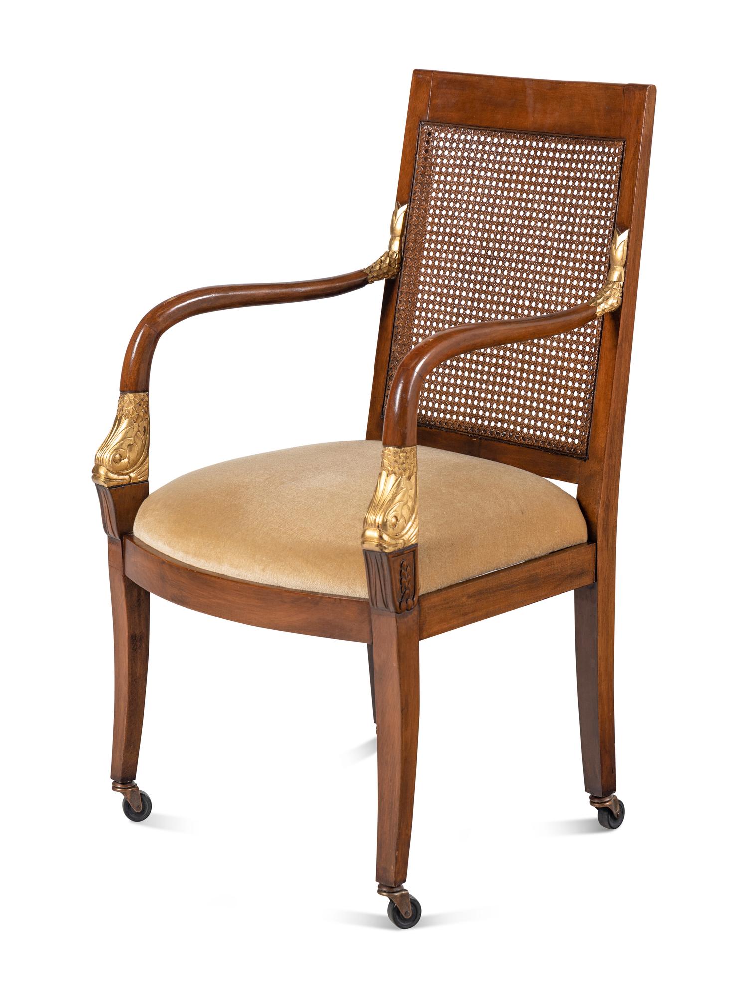 A Set of Four Baltic Style Parcel Gilt Walnut Armchairs