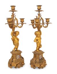 A Pair of French Gilt Bronze and Porcelain Inset Four-Light Candelabra