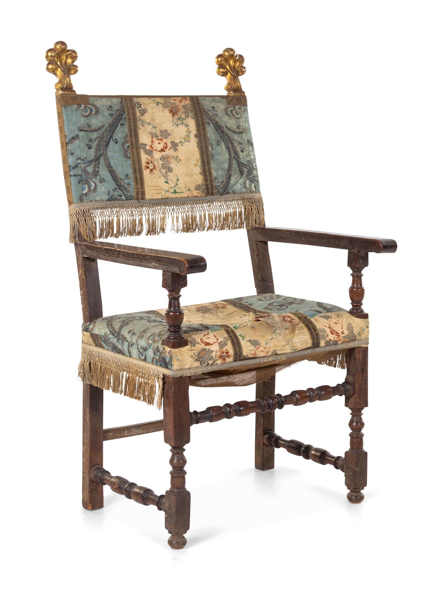 A Spanish or Italian Baroque Walnut and Giltwood Armchair