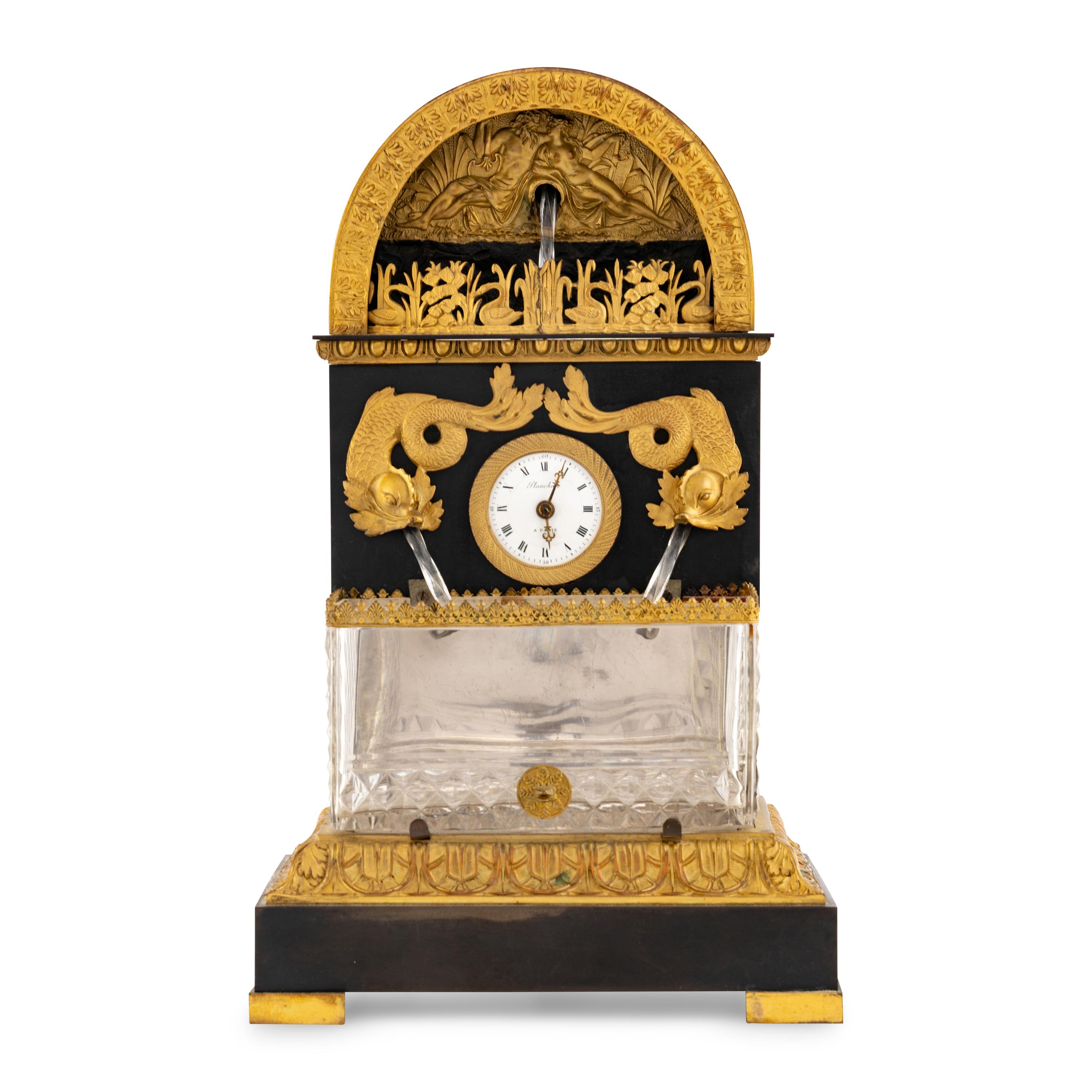 A French Patinated and Gilt Bronze and Cut Glass "Fountain" Mantel Clock
