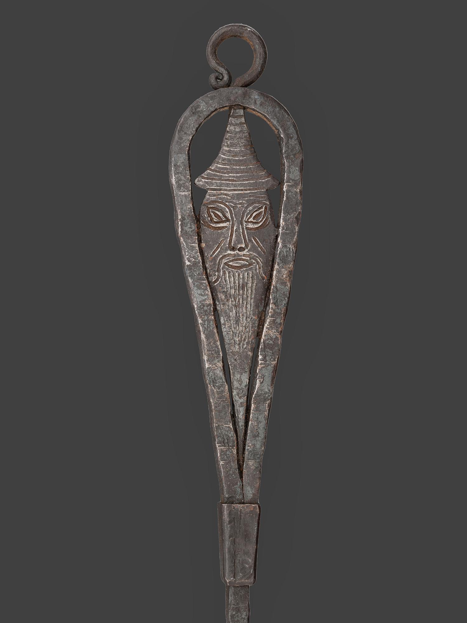 A Forged and Hammered Iron Figural Chestnut Roaster