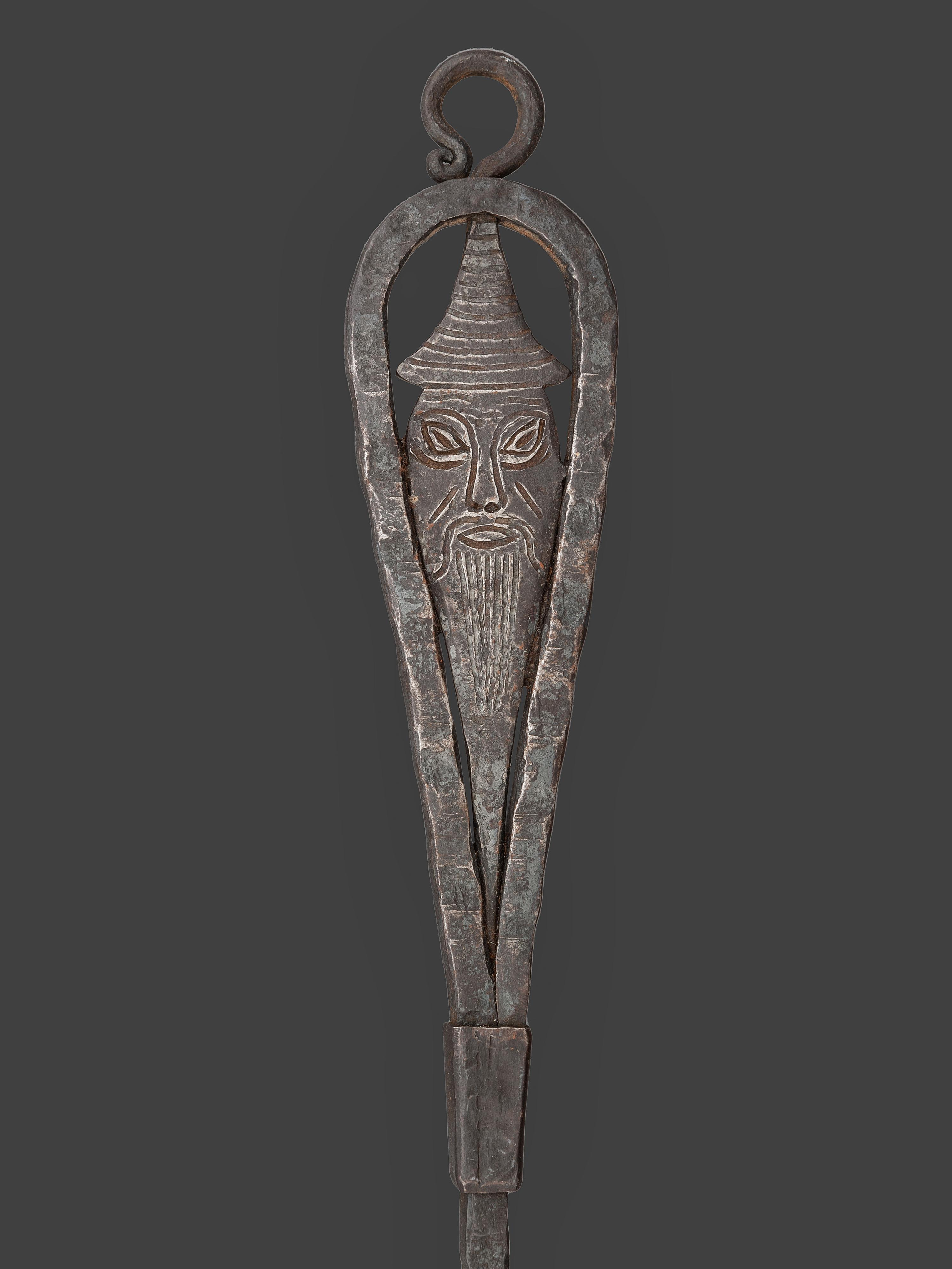 A Forged and Hammered Iron Figural Chestnut Roaster