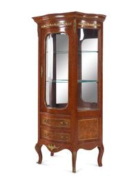 A Louis XV/XVI Transitional Style Gilt Metal Mounted Kingwood Bombe Vitrine Cabinet