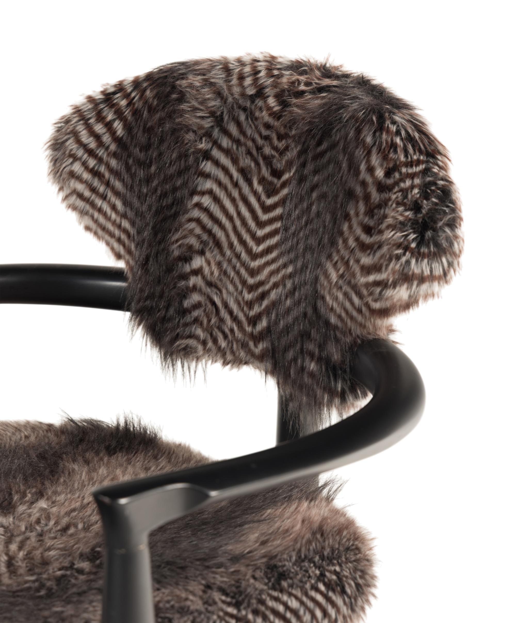 A Set of Four Faux Fur-Upholstered Ebonized Armchairs