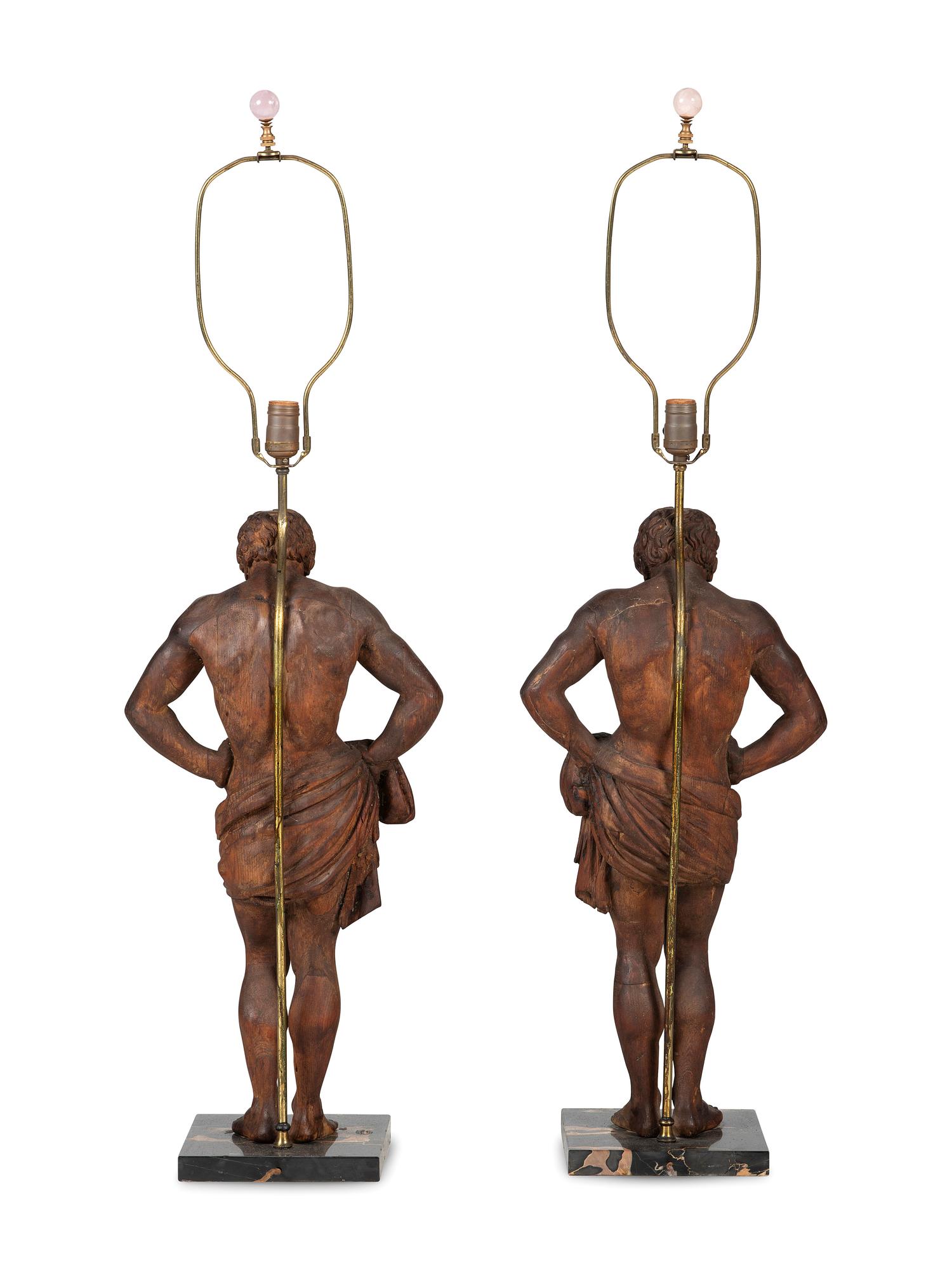 A Pair of Carved Pine Figures of Classical Men