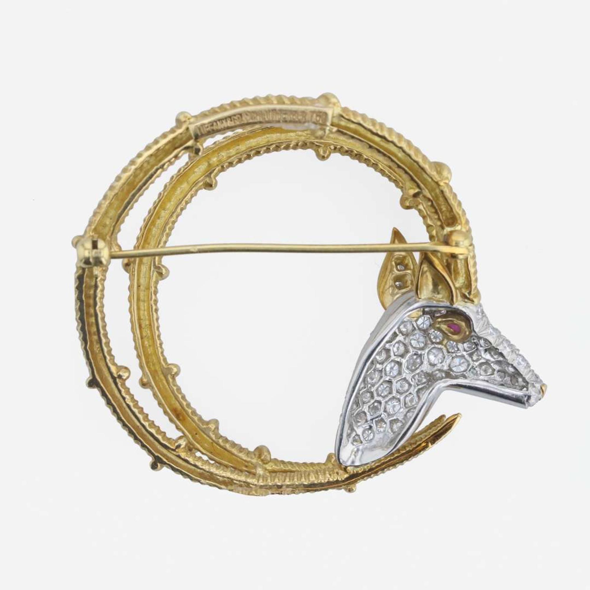 An 18K gold, platinum, diamond, and ruby brooch, Tiffany & Co. Schlumberger, "Ibex"