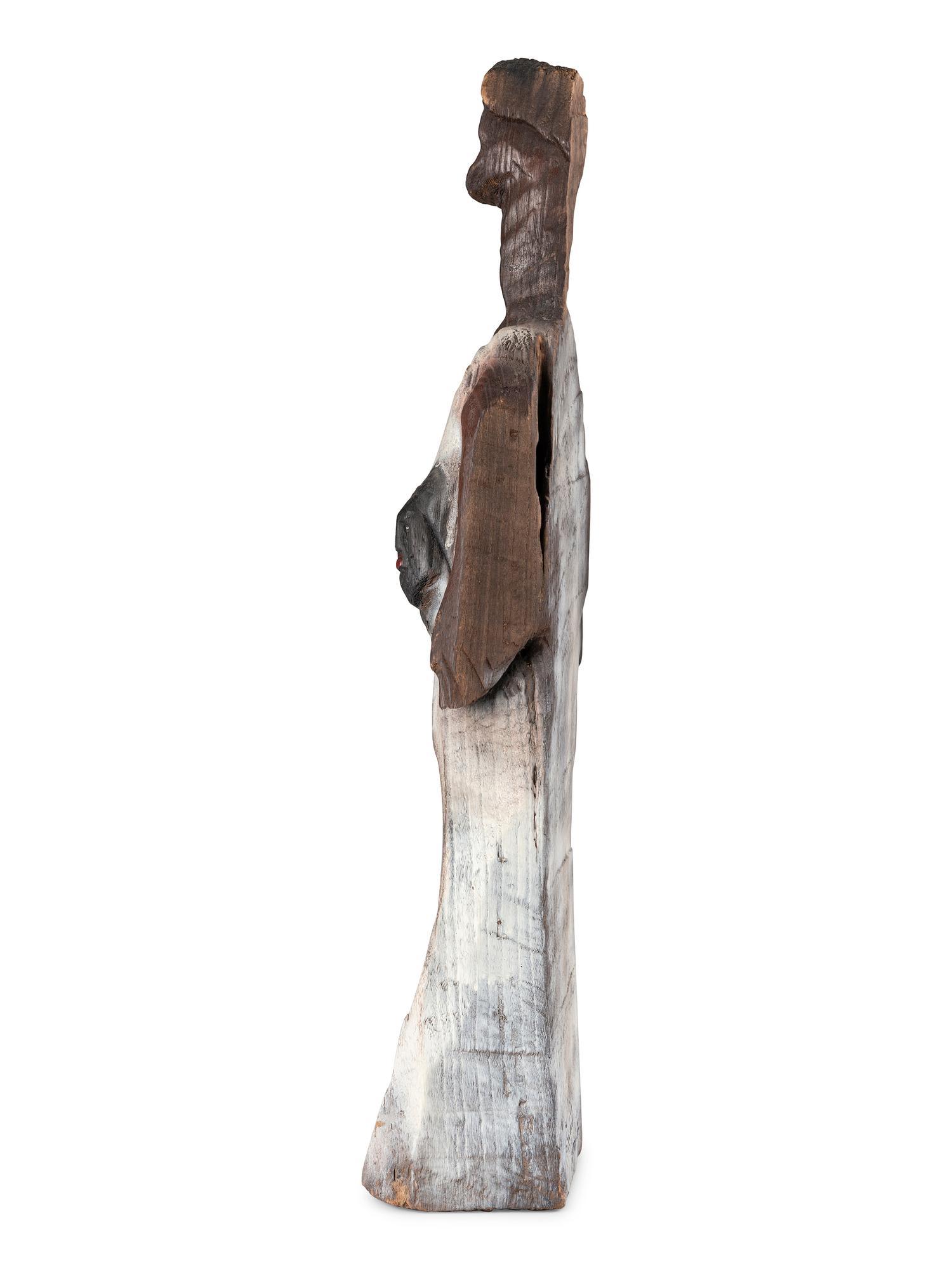 A Folk Art Carved and Painted Wooden Sculpture of a Woman with Multiple Faces