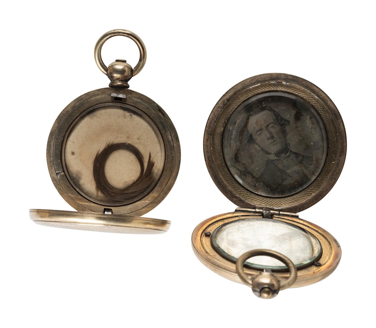 [EARLY PHOTOGRAPHY]. 11 lockets containing daguerreotypes and tintypes.