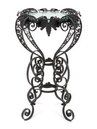 A Spanish Colonial Style Wrought Iron and Glass Stand
