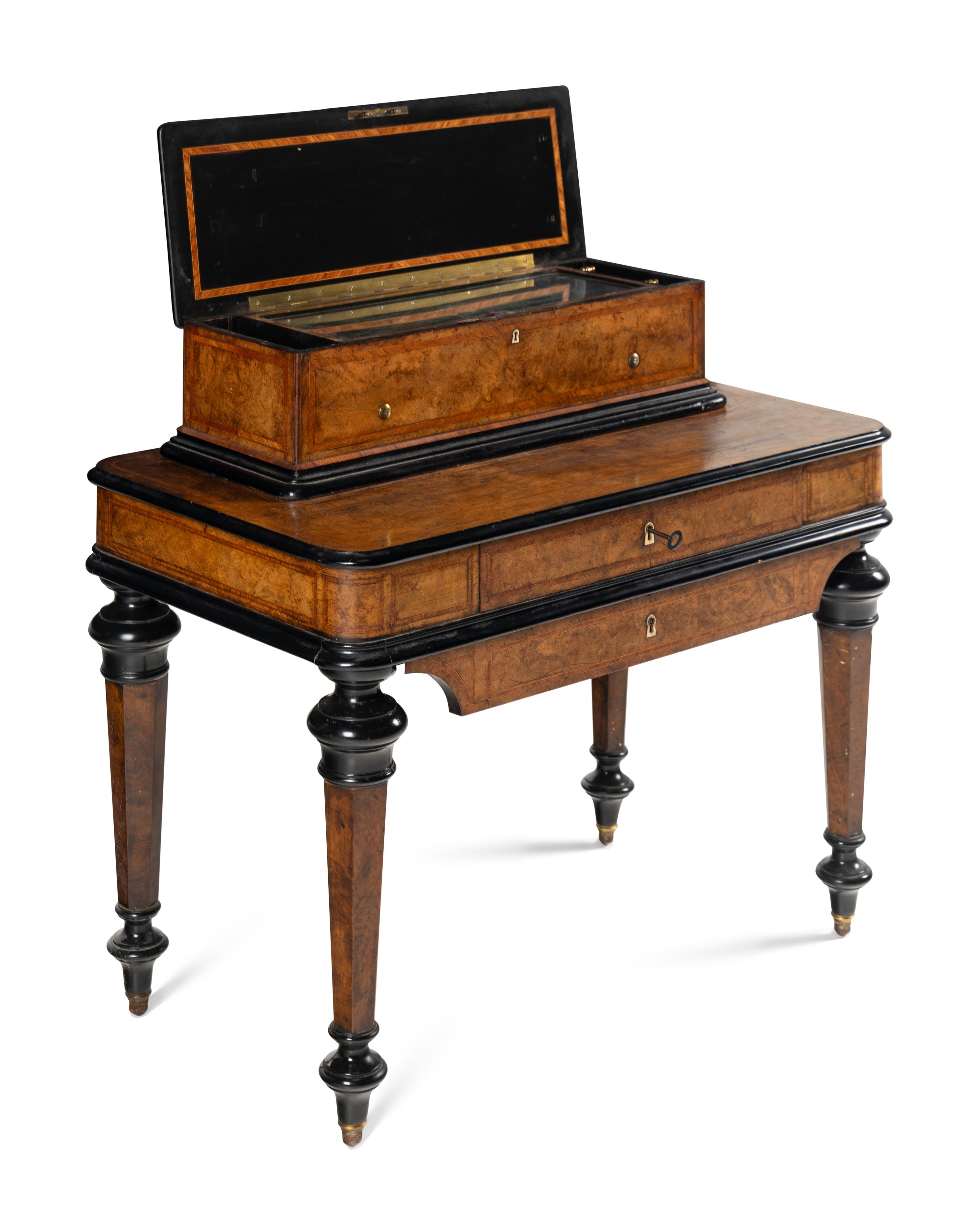 An Interchangeable Music Box on Table by Nicole Frères