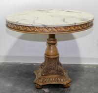 A Neoclassical Style Carved Breakfast Table Height 31 x diameter of top 36 inches. — 20TH CENTURY