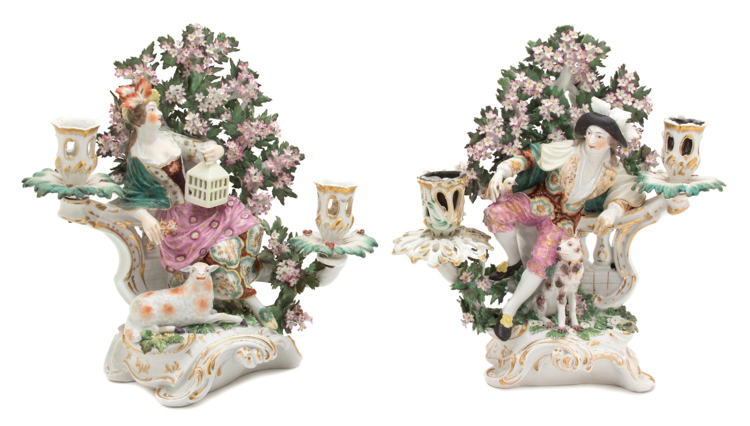 A Pair of German Porcelain Figural Candlesticks Height 11 1/2 inches. — 19TH CENTURY