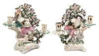 A Pair of German Porcelain Figural Candlesticks Height 11 1/2 inches. — 19TH CENTURY